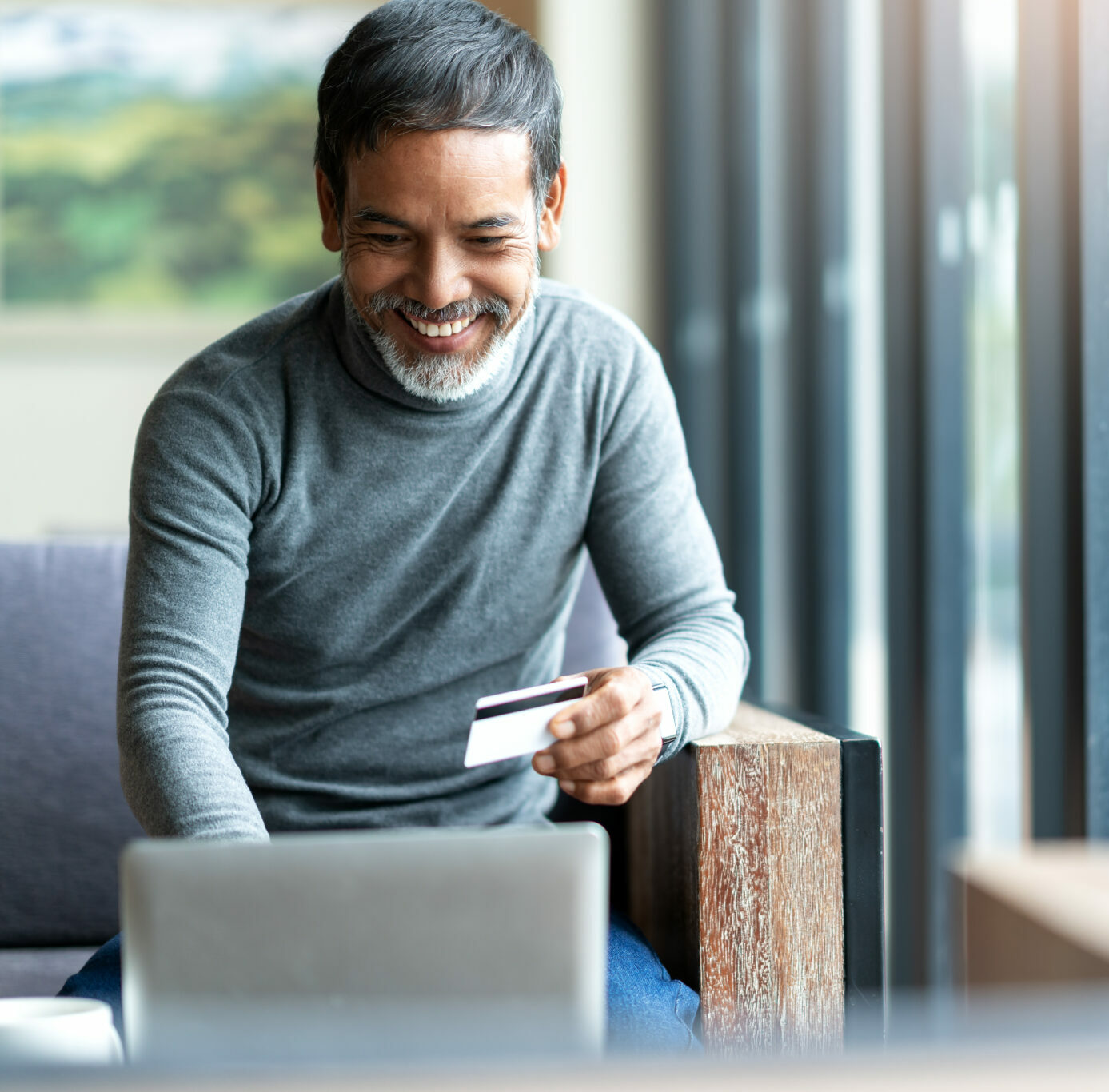 Man online shopping at home.